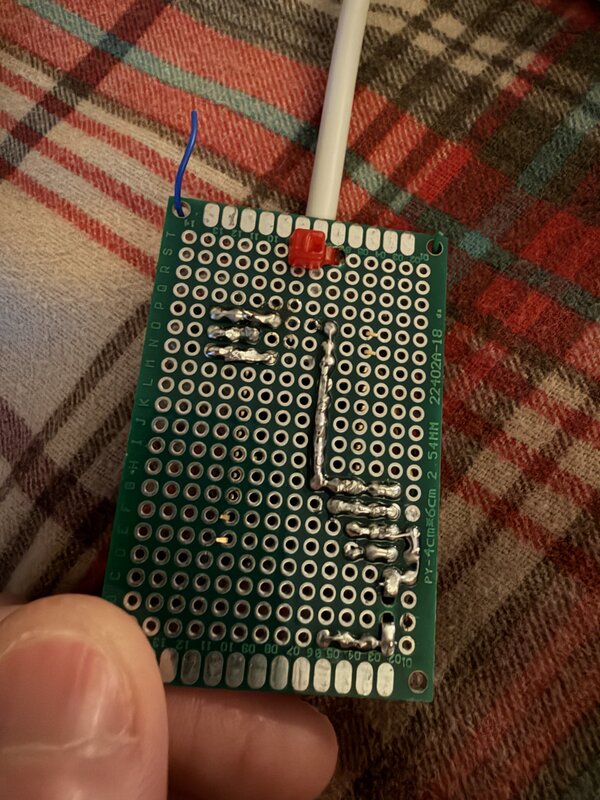 Back side of the perfboard showing solder traces